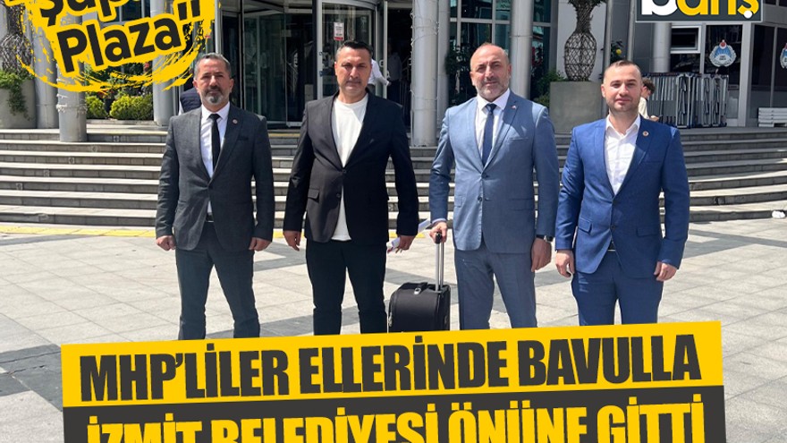 MHP’liler ellerinde bavulla İzmit Belediyesi önüne gitti