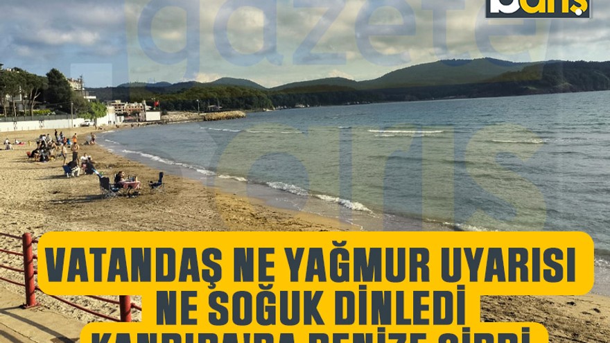 Kandıra'da sahilde oturanlar üşürken onlar denize girdi